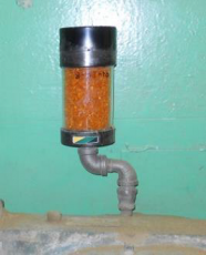 Prevent oil from fouling a desiccant breather